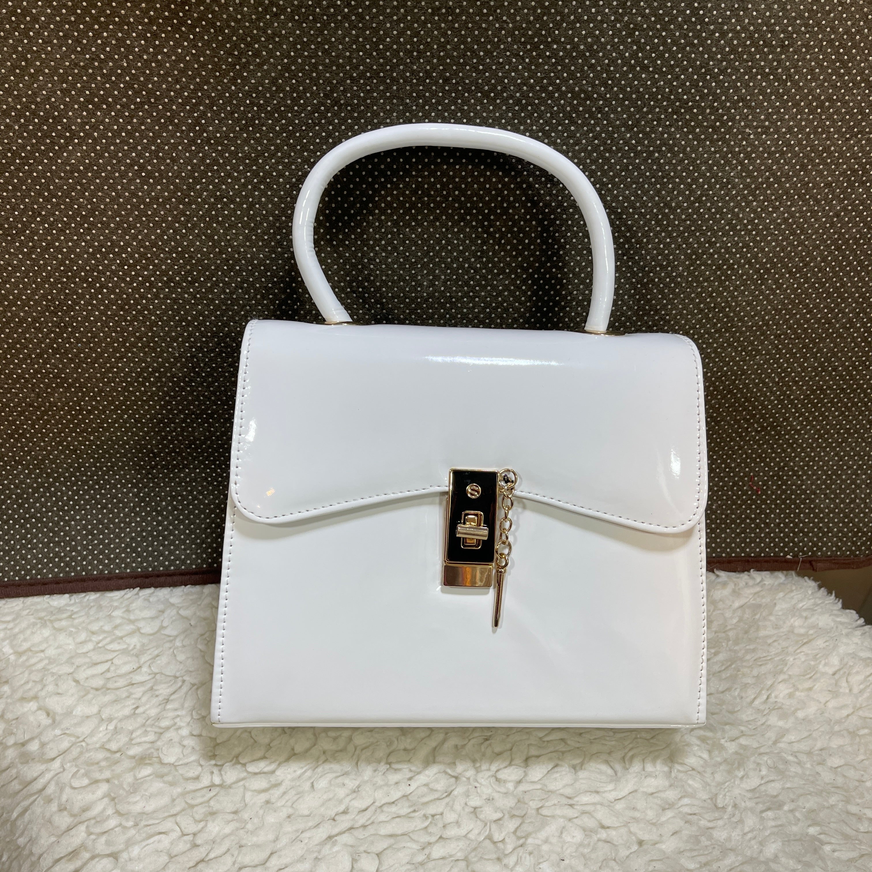 PIN LOCK HANDBAGS