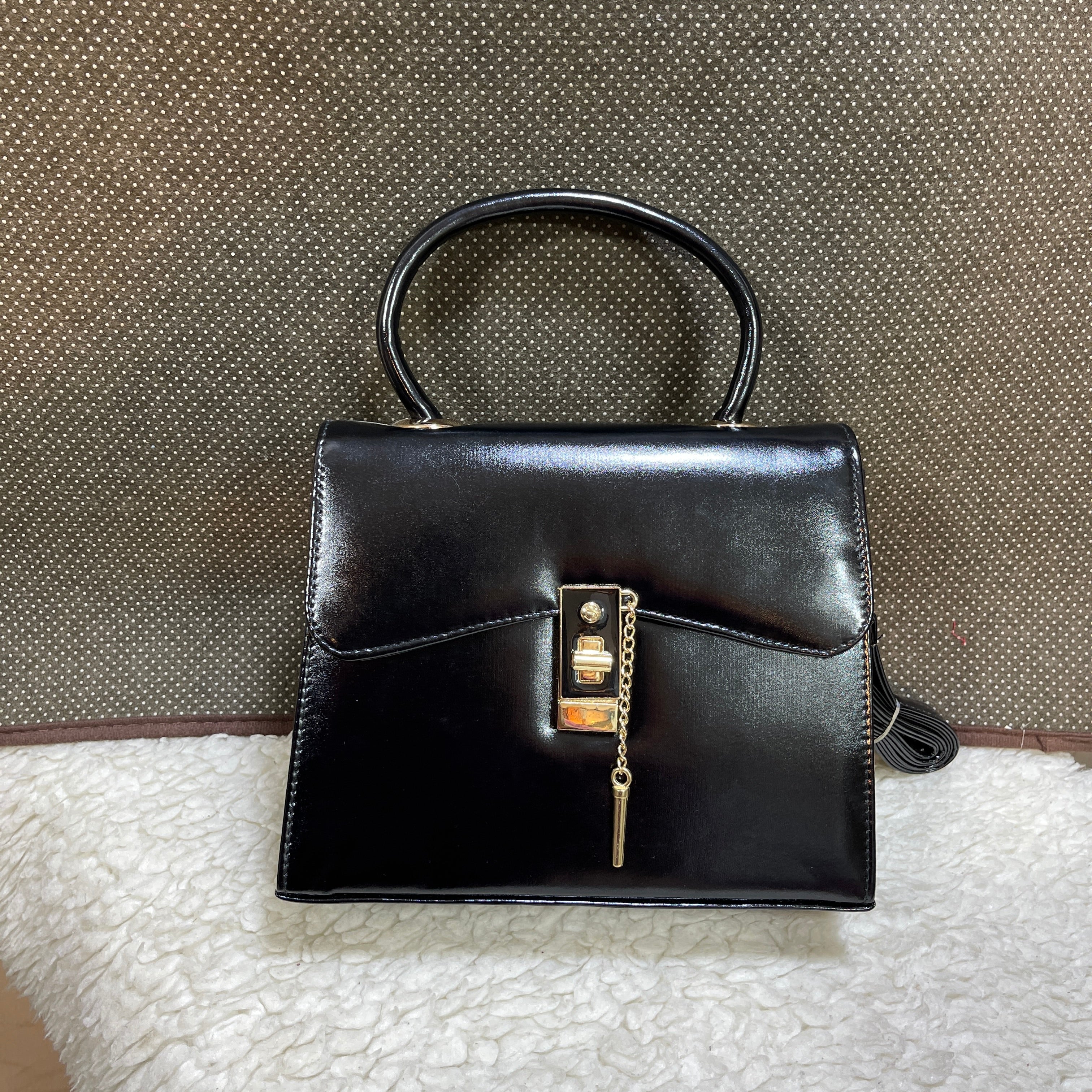 PIN LOCK HANDBAGS